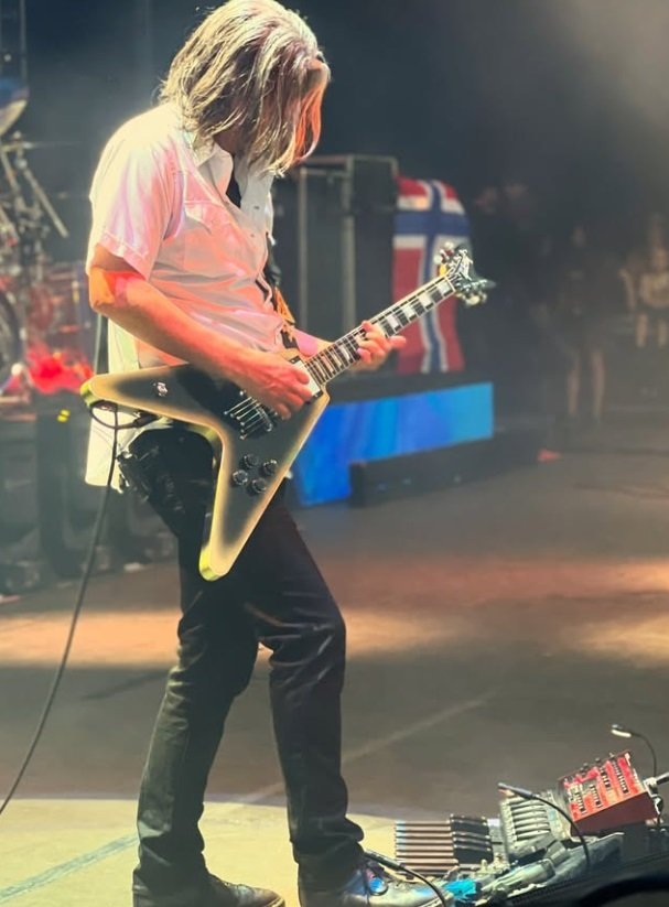 Tool's Adam Jones and his Flying V electric. Tool's Adam Jones and his Flying V electric.